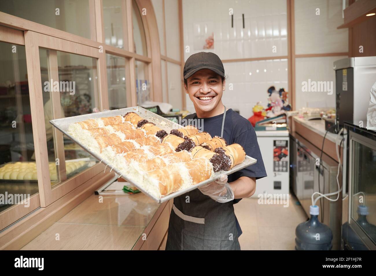 Young baker assistant hi-res stock photography and images - Alamy