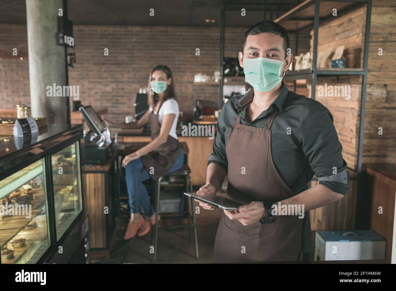 cafe owner using tablet pc Stock Photo