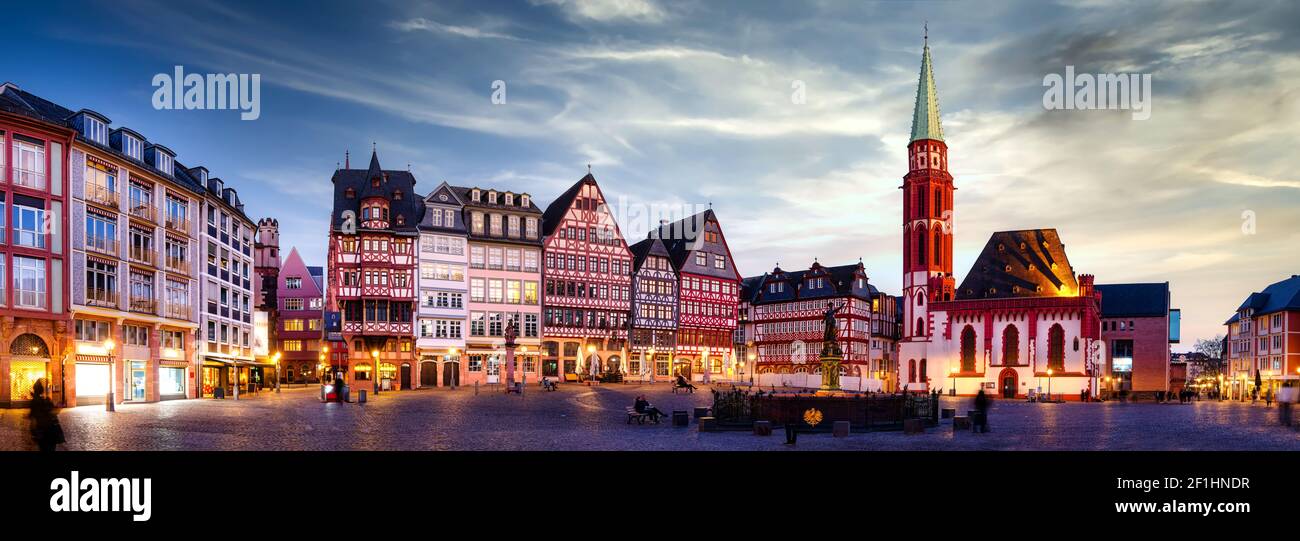 Panorama of the Römerberg in Frankfurt am Main with illuminated buildings at sunset Stock Photo