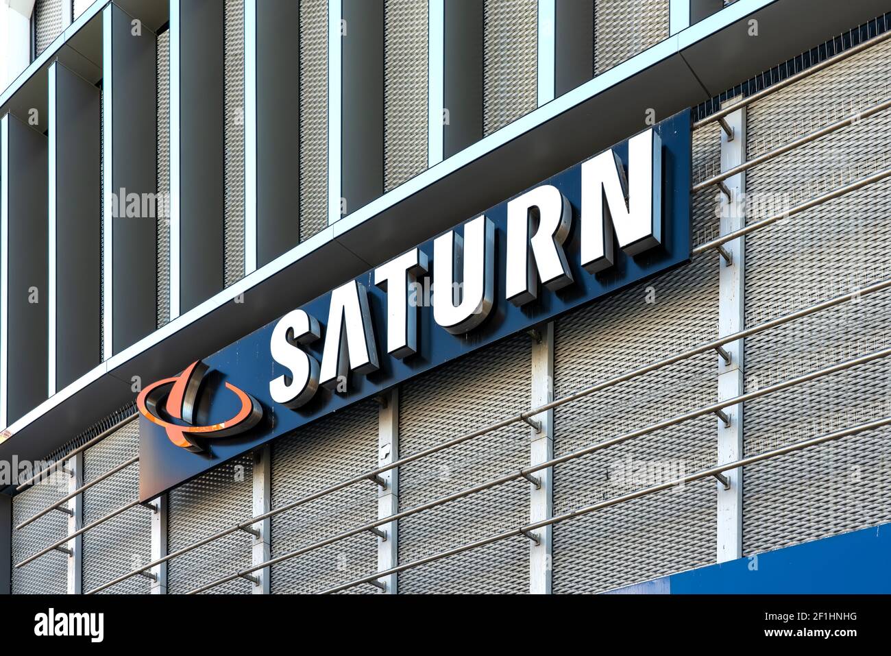 Saturn Logo on Aluminum Mesh Expanded Lattice Building Facade in Frankfurt am Main Stock Photo