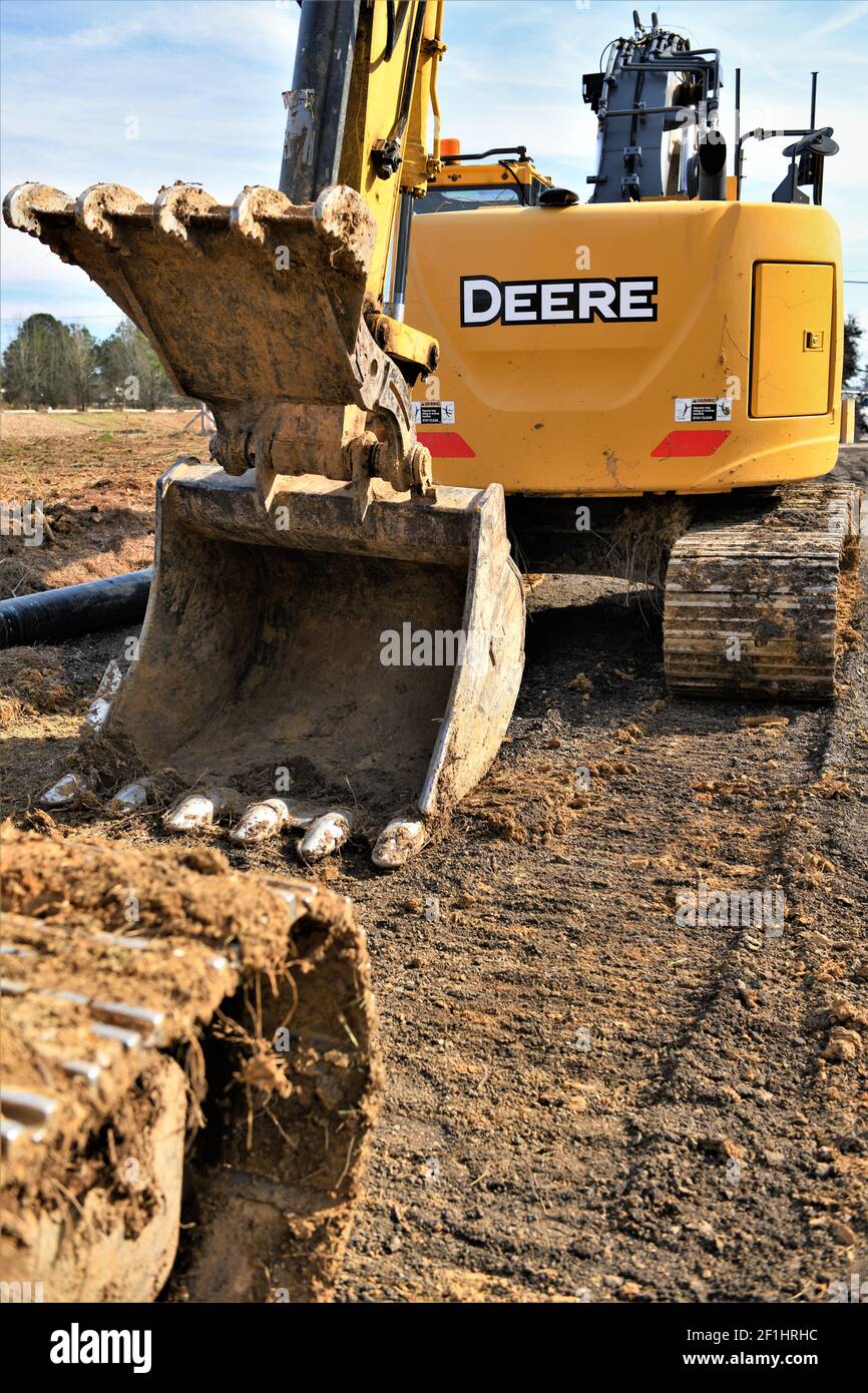 Komatsu and John Deere trackhoe construction equipment. Stock Photo