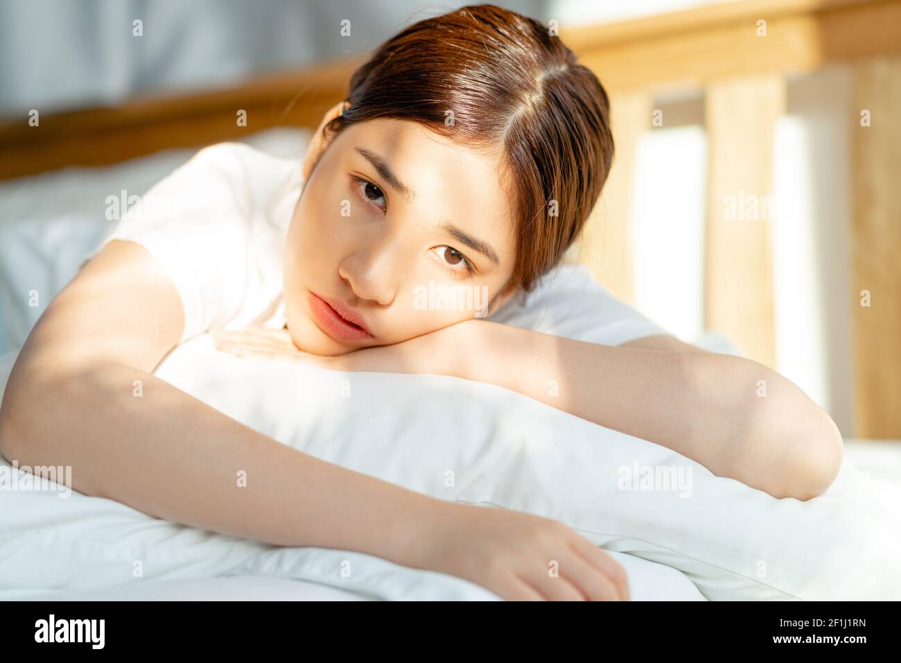 The beautiful Asian woman just woke up when the sun was up Stock Photo -  Alamy