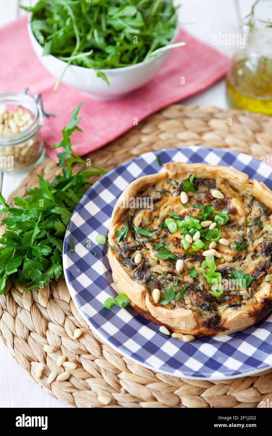 Small quiche with feta and spinach Stock Photo Alamy
