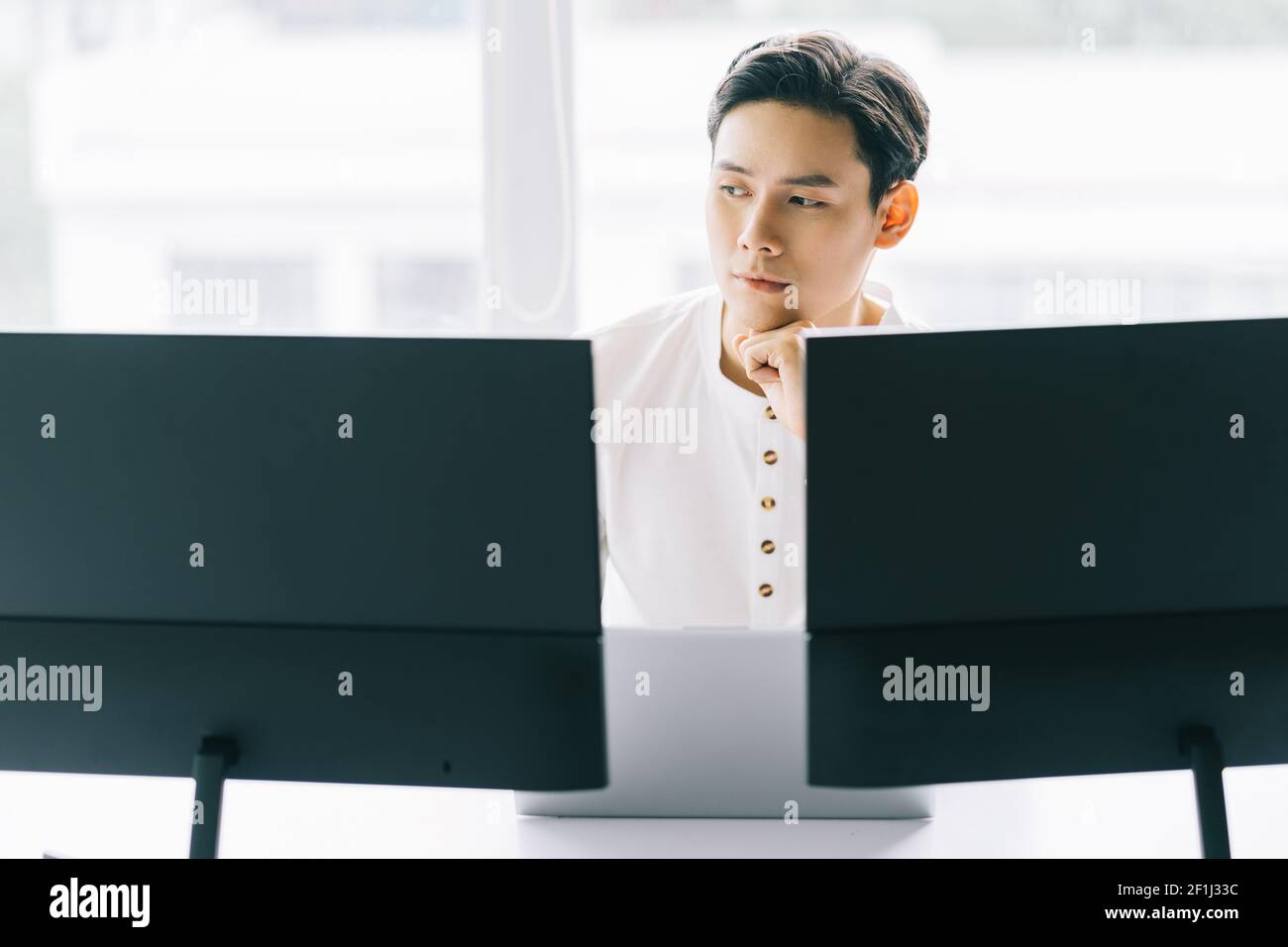 Asian programmers are focused on working to fulfill the assigned deadlines Stock Photo