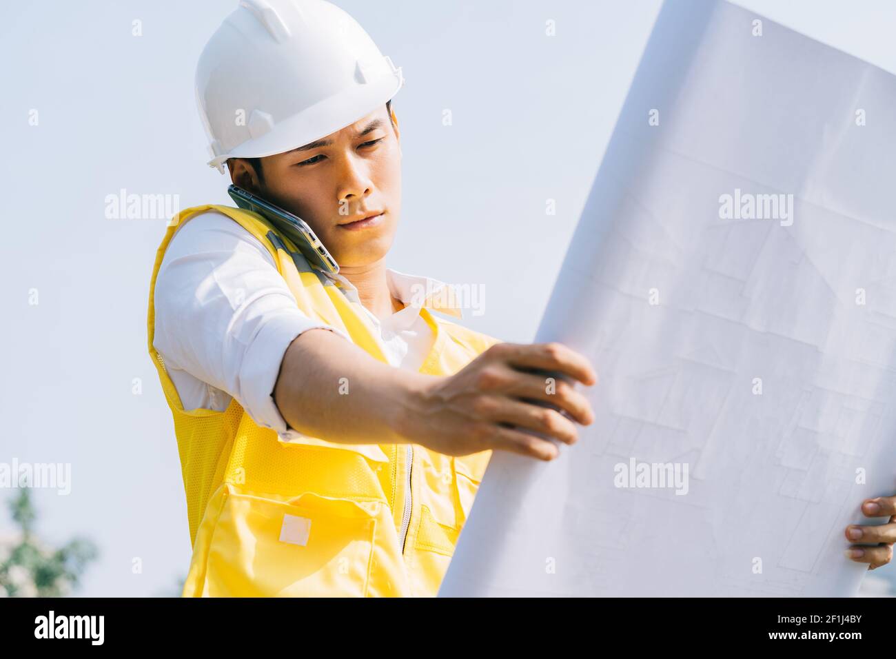 Asian construction engineers are doing experimental tests at the site Stock Photo
