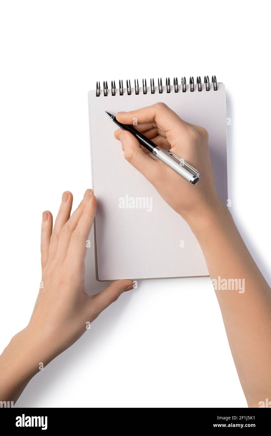 Woman's holding pen and writing in notebook Stock Photo