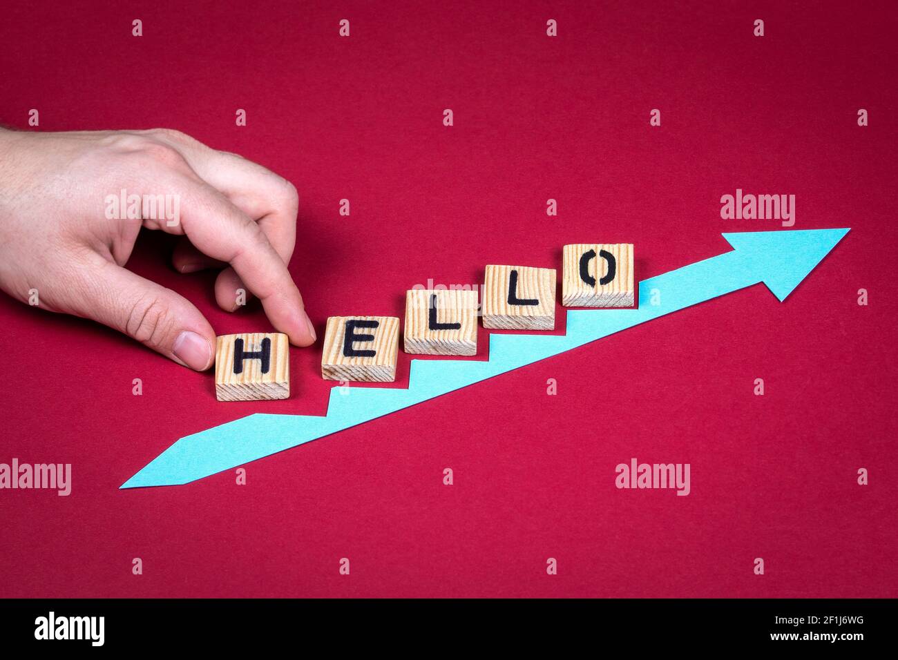 HELLO. Red arrow indicates the development and growth. Stock Photo