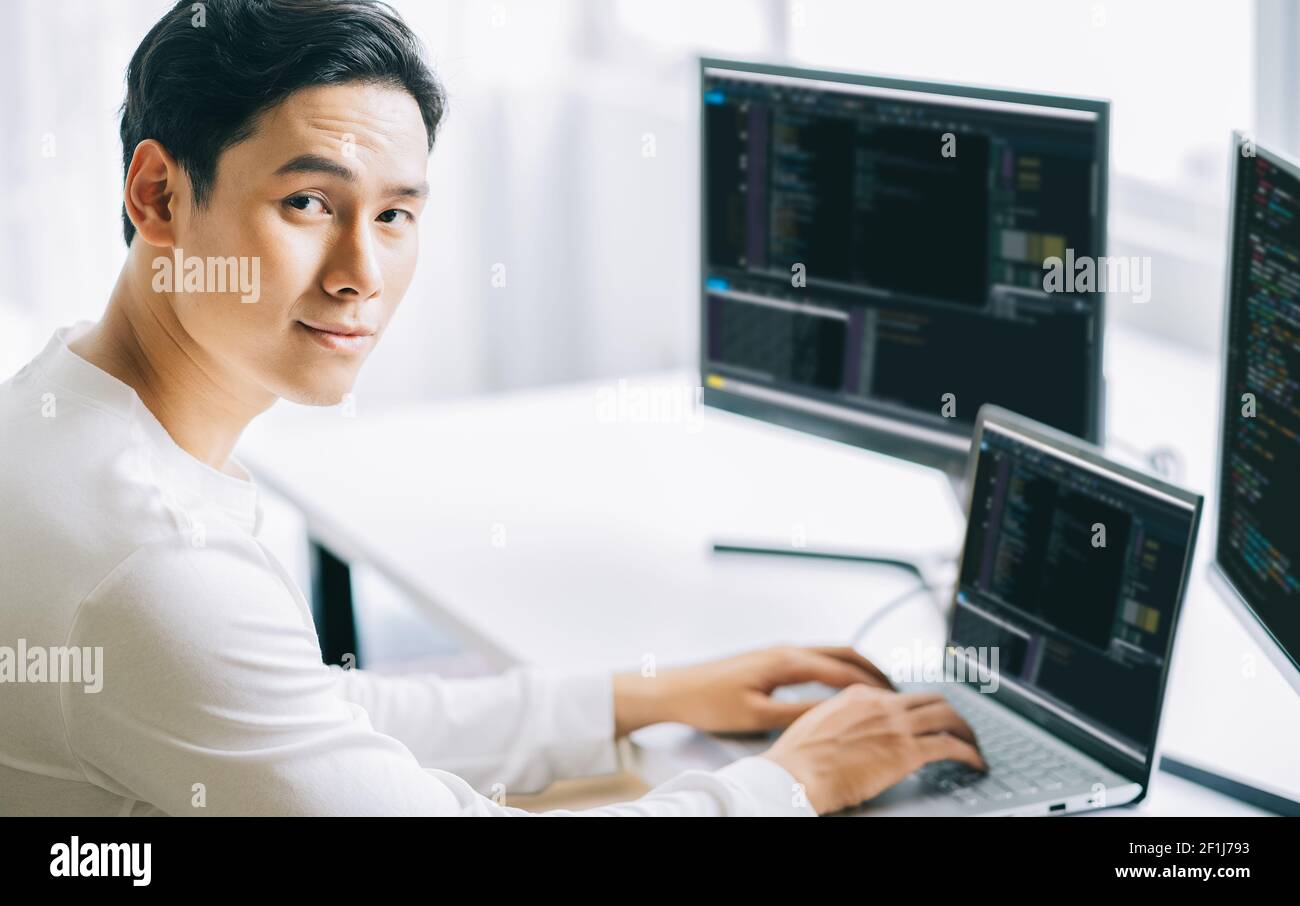 Asian male programmers are developing security software for computer systems Stock Photo