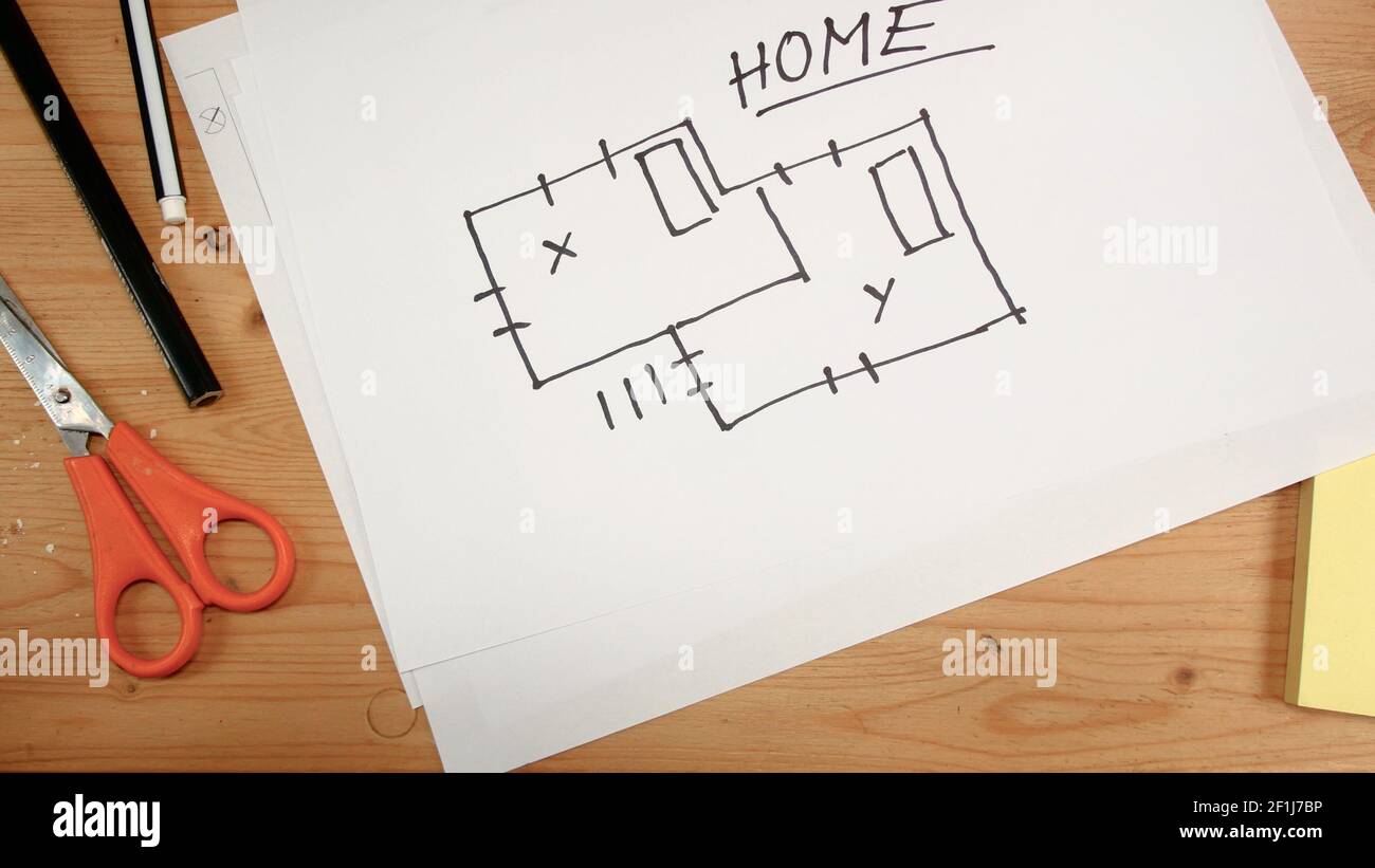 Top view, an interior designer's hand draws an ideal map for a new home, footage ideal for topics su Stock Photo