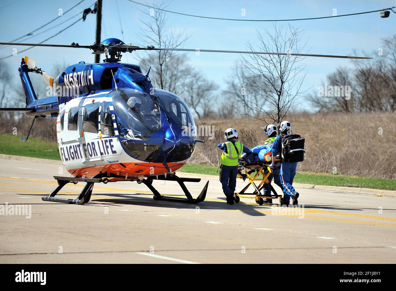 Bartlett, Illinois, USA. Following a serious car crash a victim being delivered, via stretcher