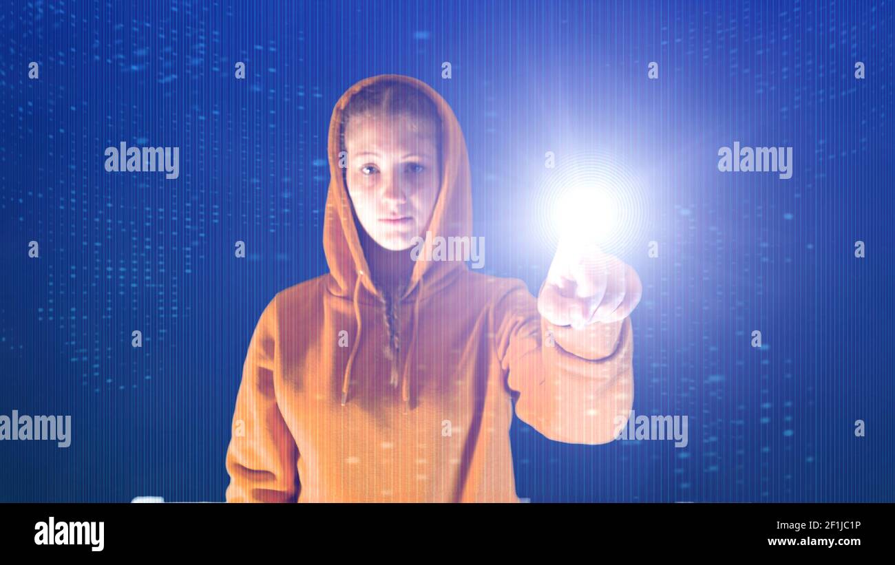 Hooded girl points with her hand in a cyberspace digital environment, ideal for topics such as ecolo Stock Photo