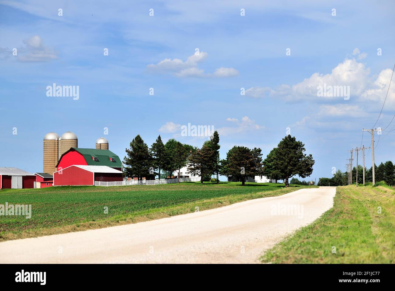 Maple Park, USA. A large agricultural spread sitting along side a dirt road in the middle of