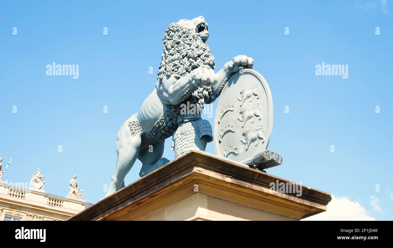 Lion statue, Neues Schloss behind the fountain, domicile of the Ministry of Finance, palace in Schlossplatz square, Stuttgart, c Stock Photo