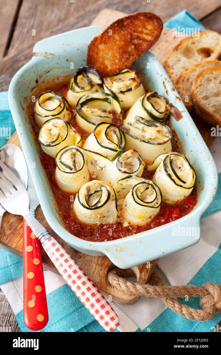 Rolled zuccini with tomato sauce Stock Photo