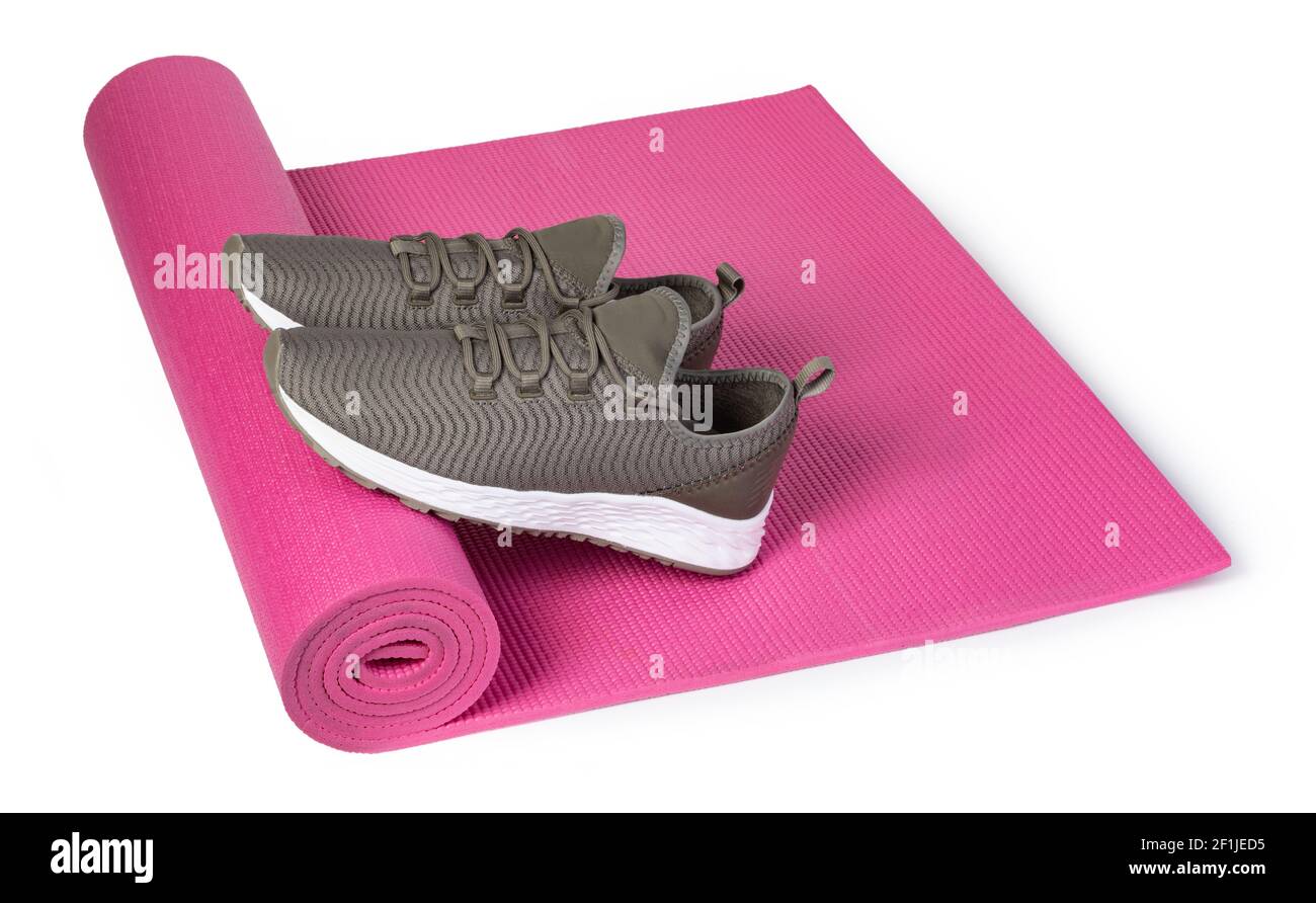 Sport shoes and yoga mat Stock Photo