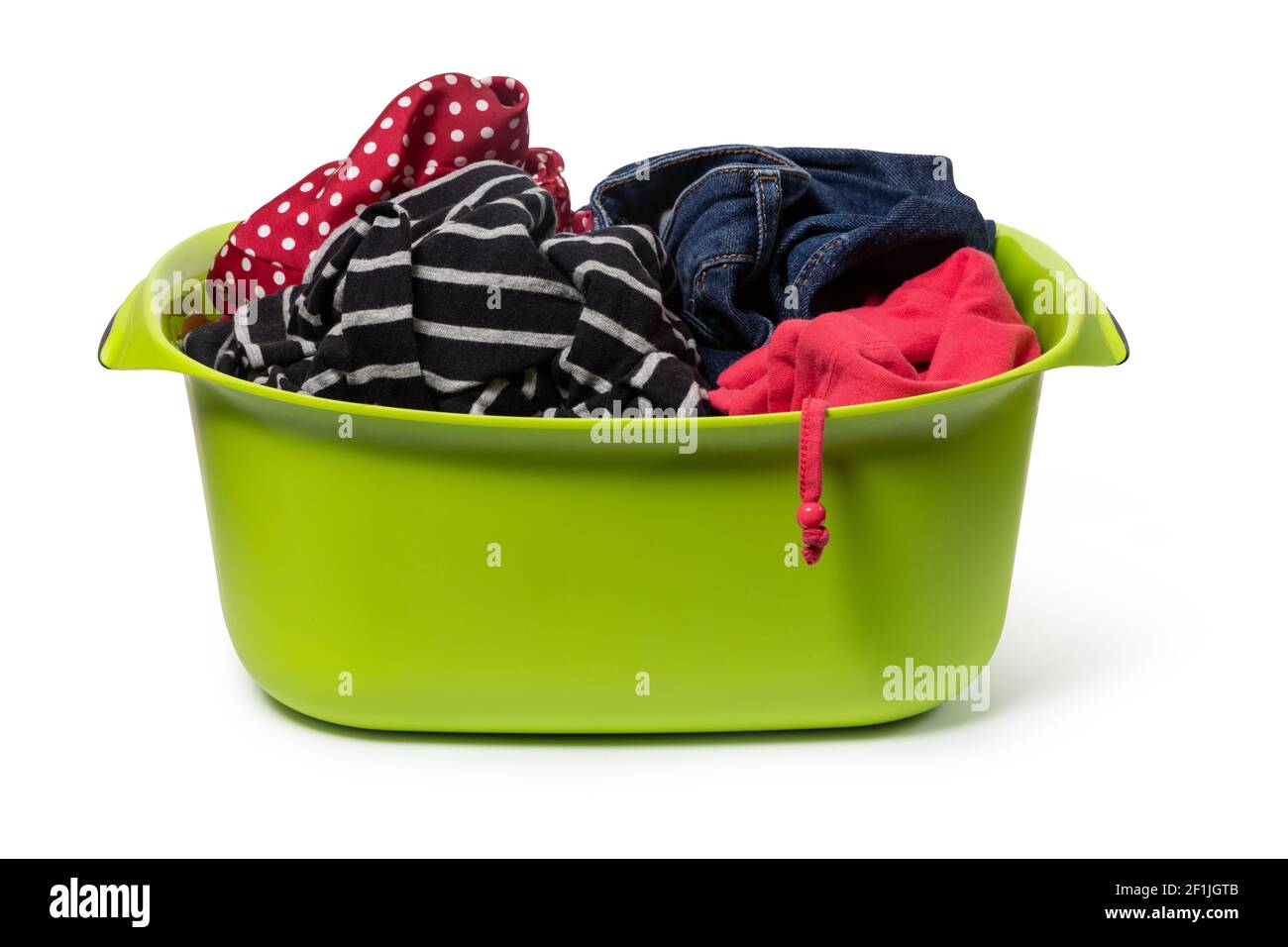 Green plastic wash bowl with clothing Stock Photo