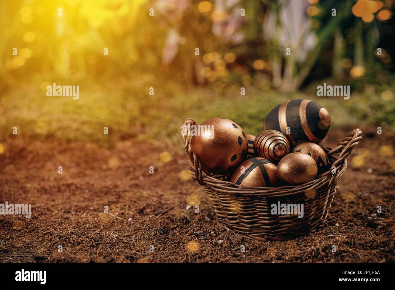 Happy Easter background with golden shine decorated eggs, copy space Stock Photo
