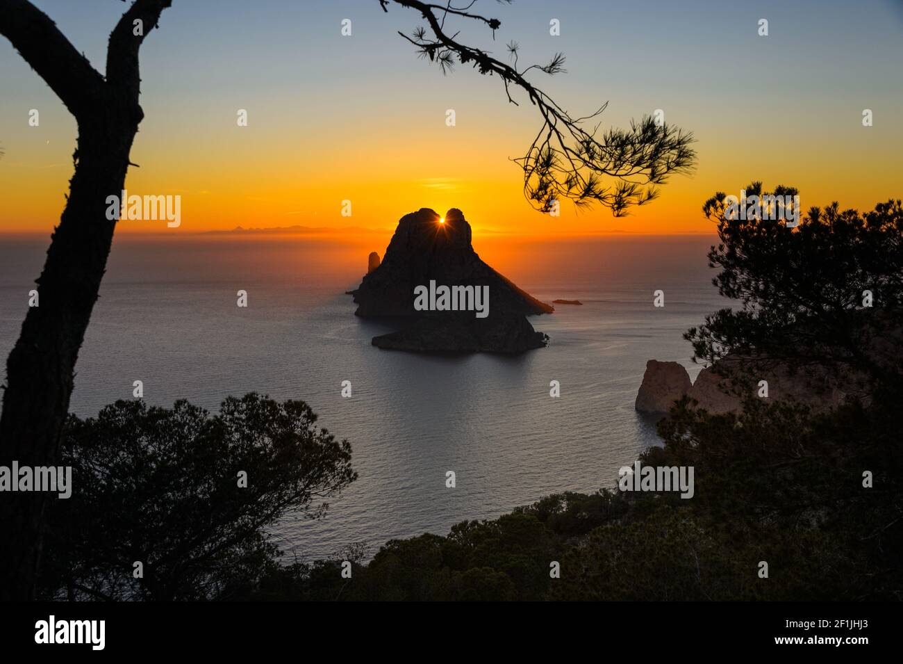 Panoramic view of the islet of the 'Es Vedra' in Ibiza. Es Vedra is closely related to the magic of the island and is an icon of Ibiza. Visited by tho Stock Photo