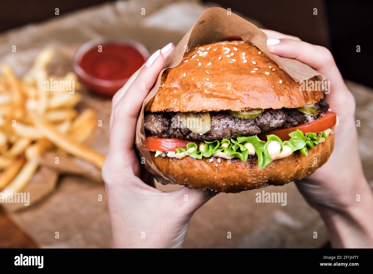 Burger on a wooden board Stock Photo