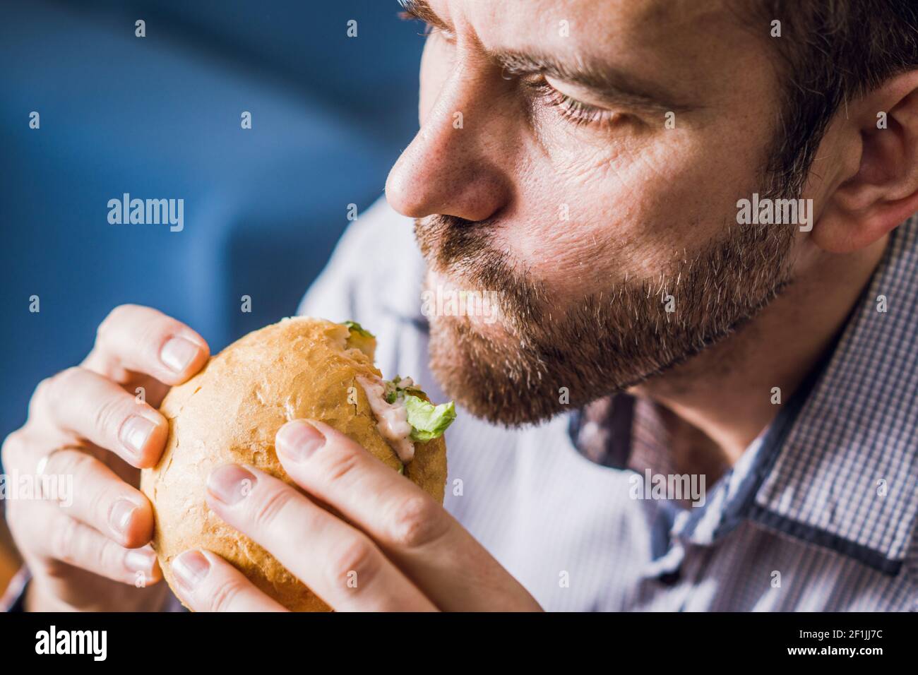 Fat man eating burger restaurant hi-res stock photography and images ...