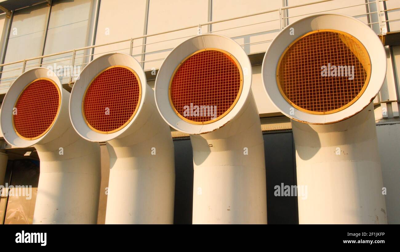 Vent pipes of a ship at the port of Genoa, towards evening Stock Photo