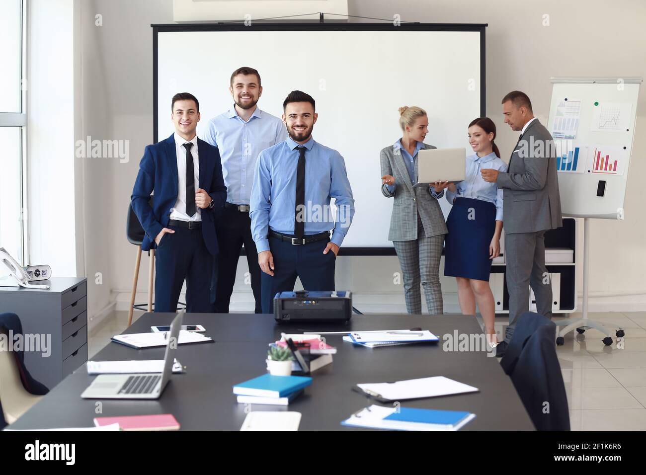Portrait of business people during meeting in office Stock Photo - Alamy