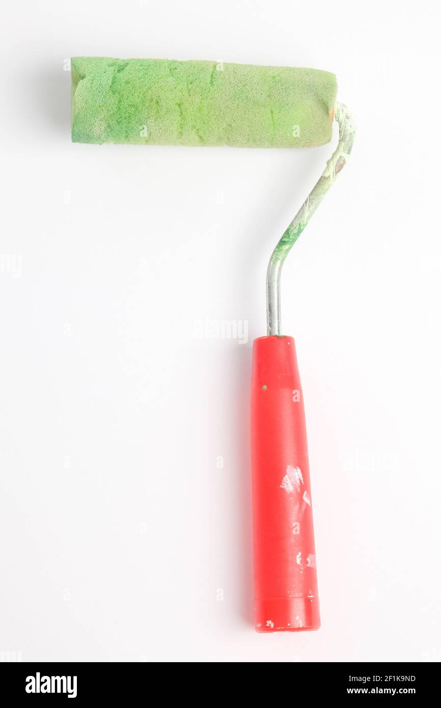 Paint roller in front of a white background Stock Photo