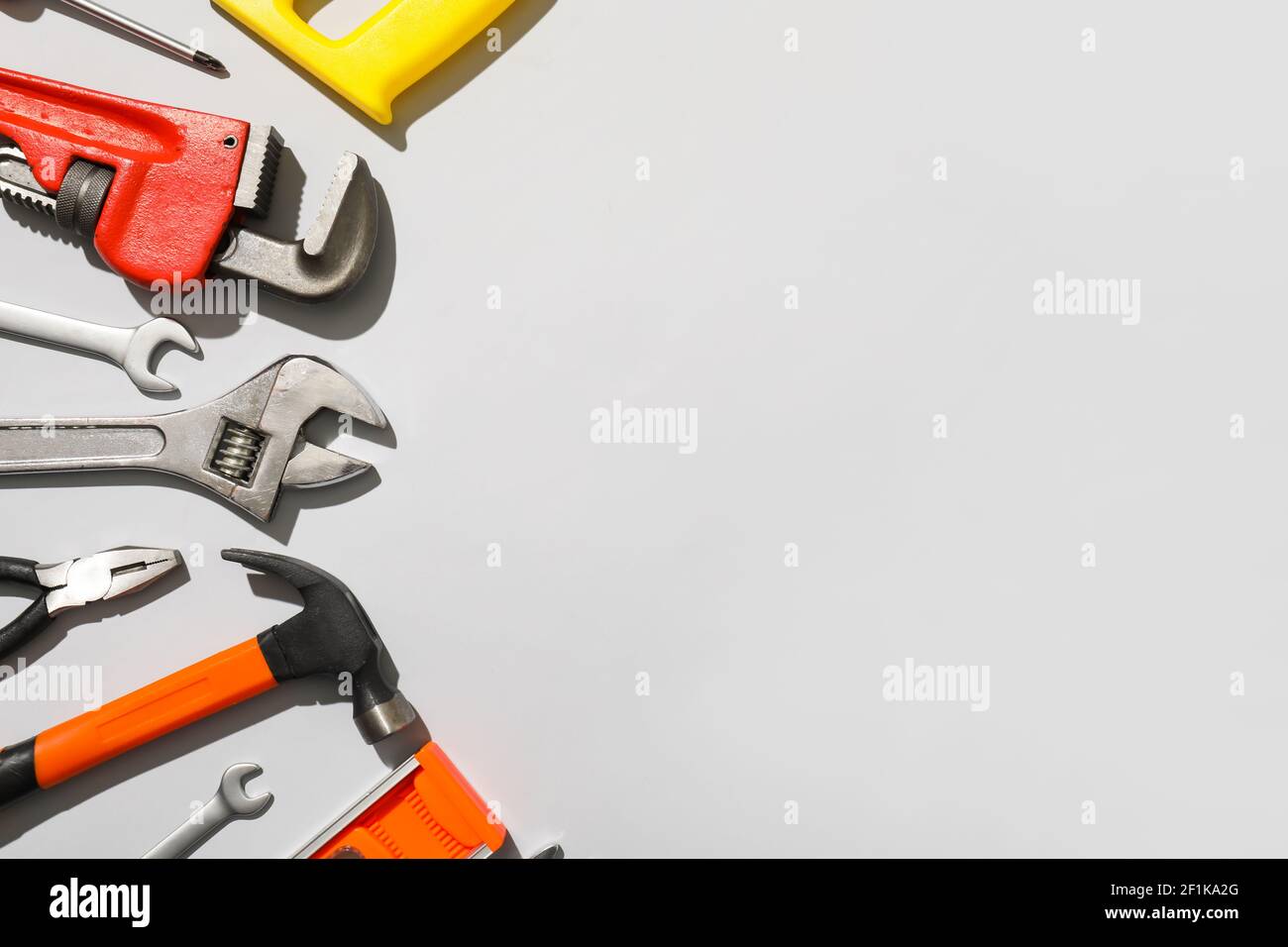 Set of construction tools on light background Stock Photo - Alamy