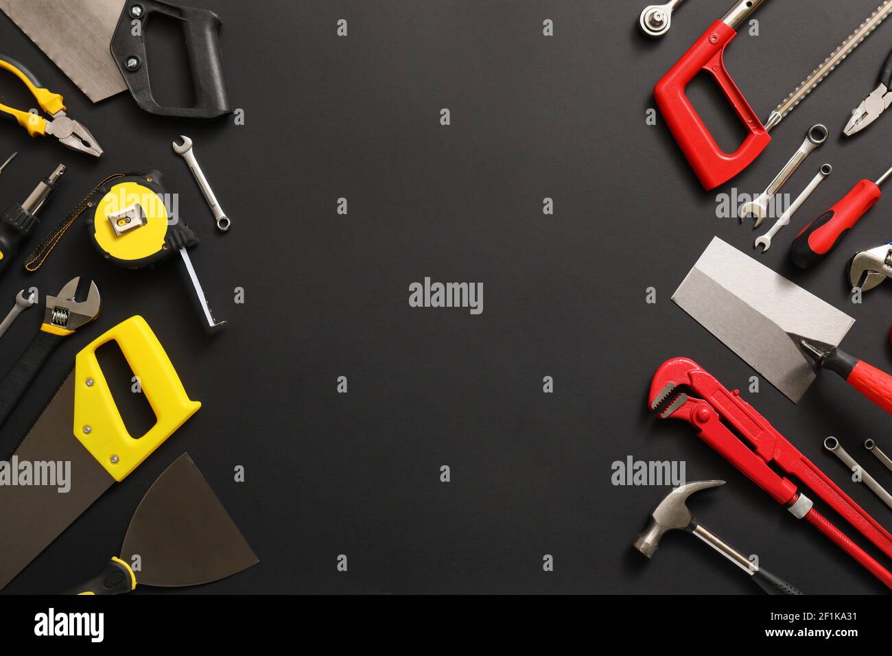 Set of construction tools on dark background Stock Photo - Alamy