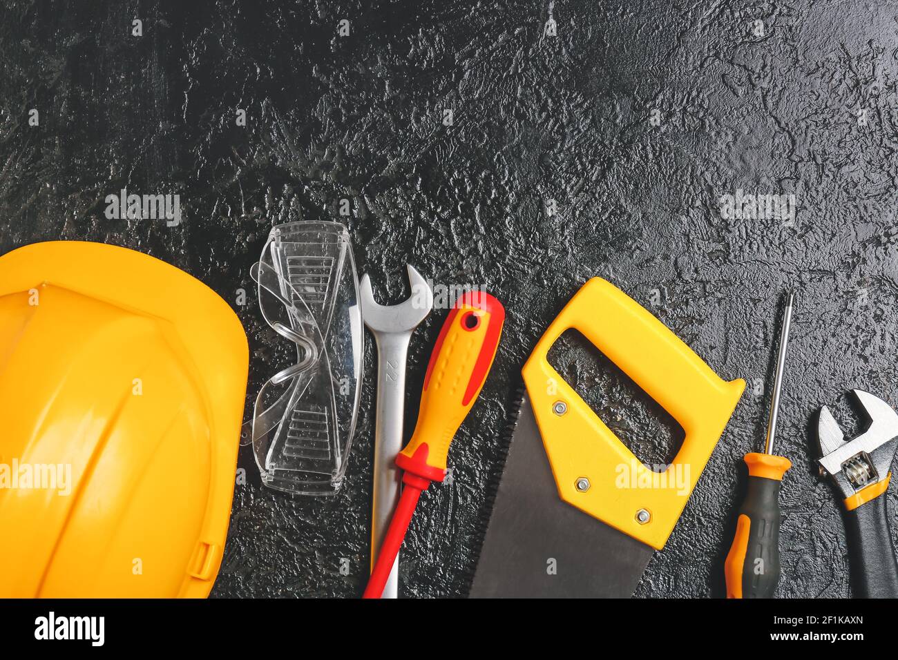 Set of construction tools on dark background Stock Photo - Alamy