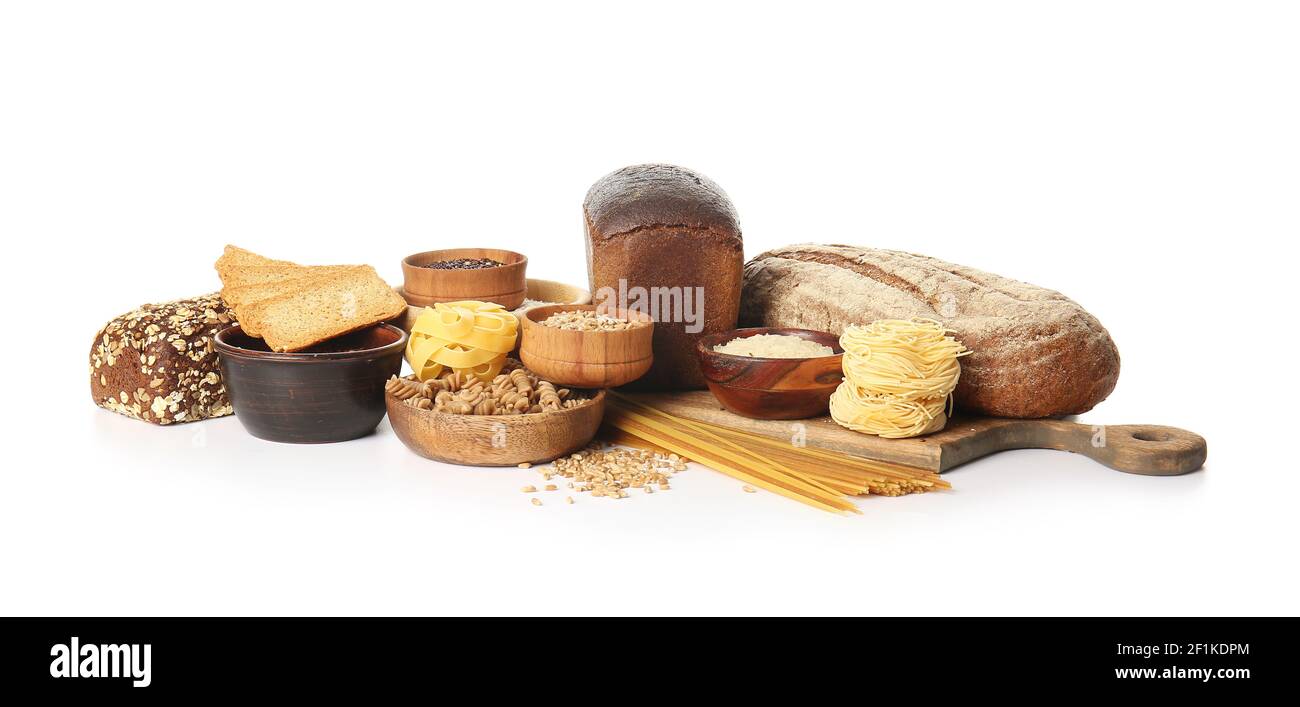 Composition with different cereals, raw pasta and bread on white background Stock Photo