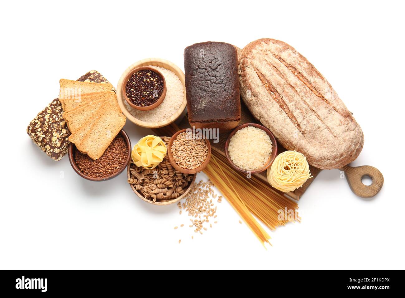 Composition with different cereals, raw pasta and bread on white background Stock Photo