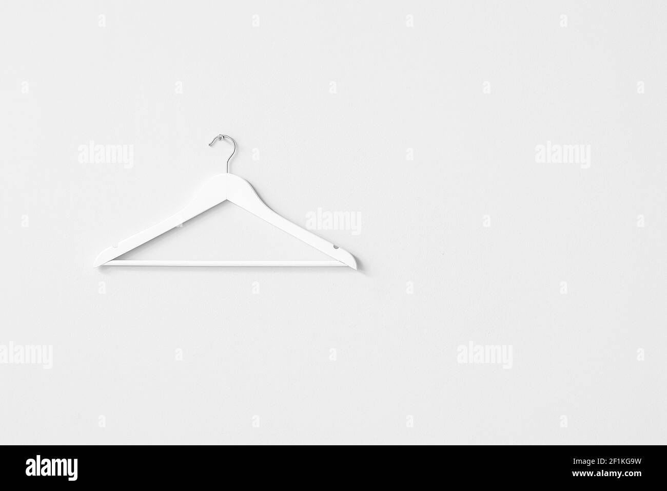 Clothes hanger on light background Stock Photo