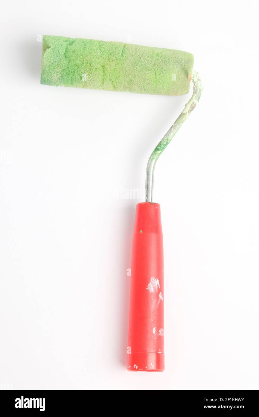 Paint roller in front of a white background Stock Photo