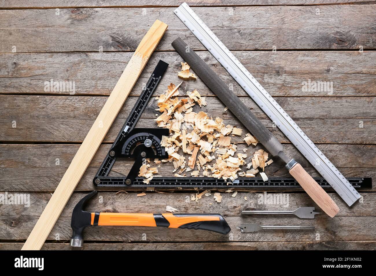 Set of carpenter's tools and saw dust on wooden background Stock Photo ...