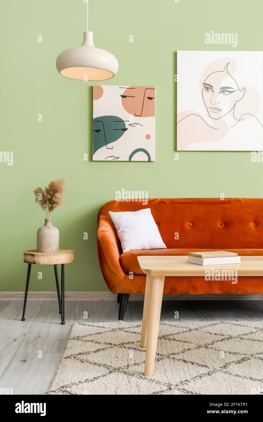 Stylish sofa and table in interior of modern living room Stock Photo ...