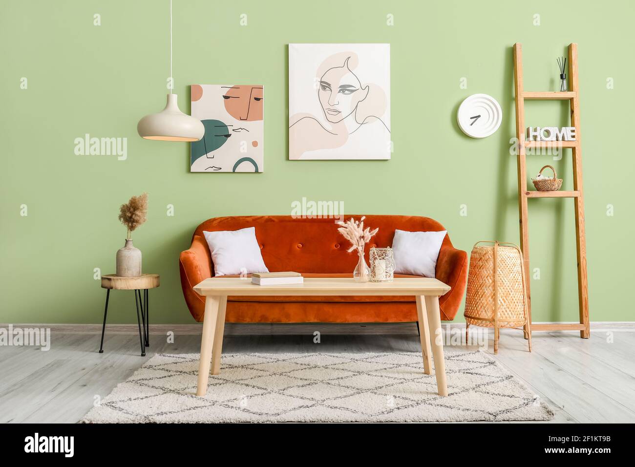 Stylish sofa and table in interior of modern living room Stock Photo ...