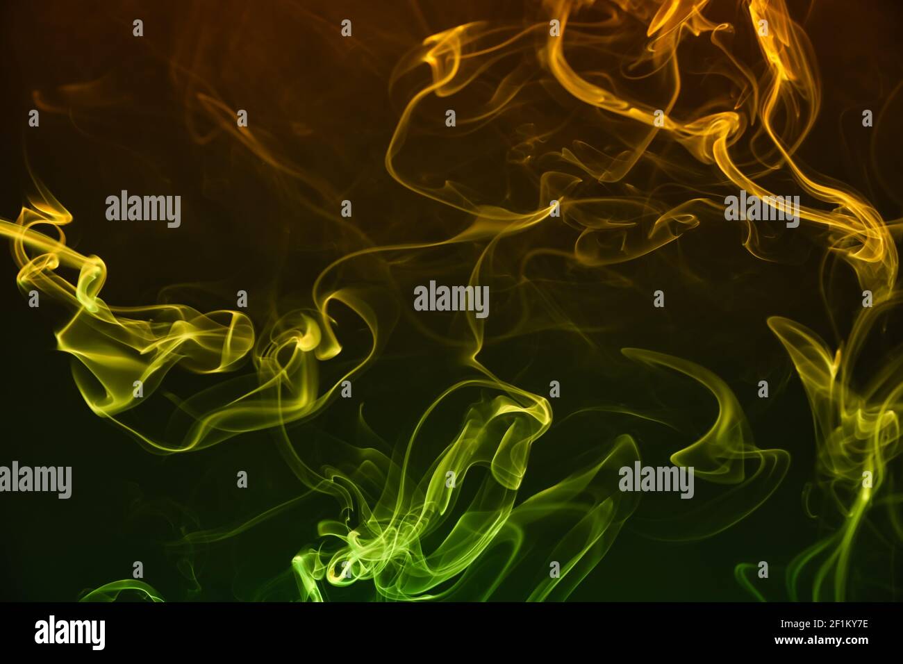 Color smoke on dark background Stock Photo - Alamy