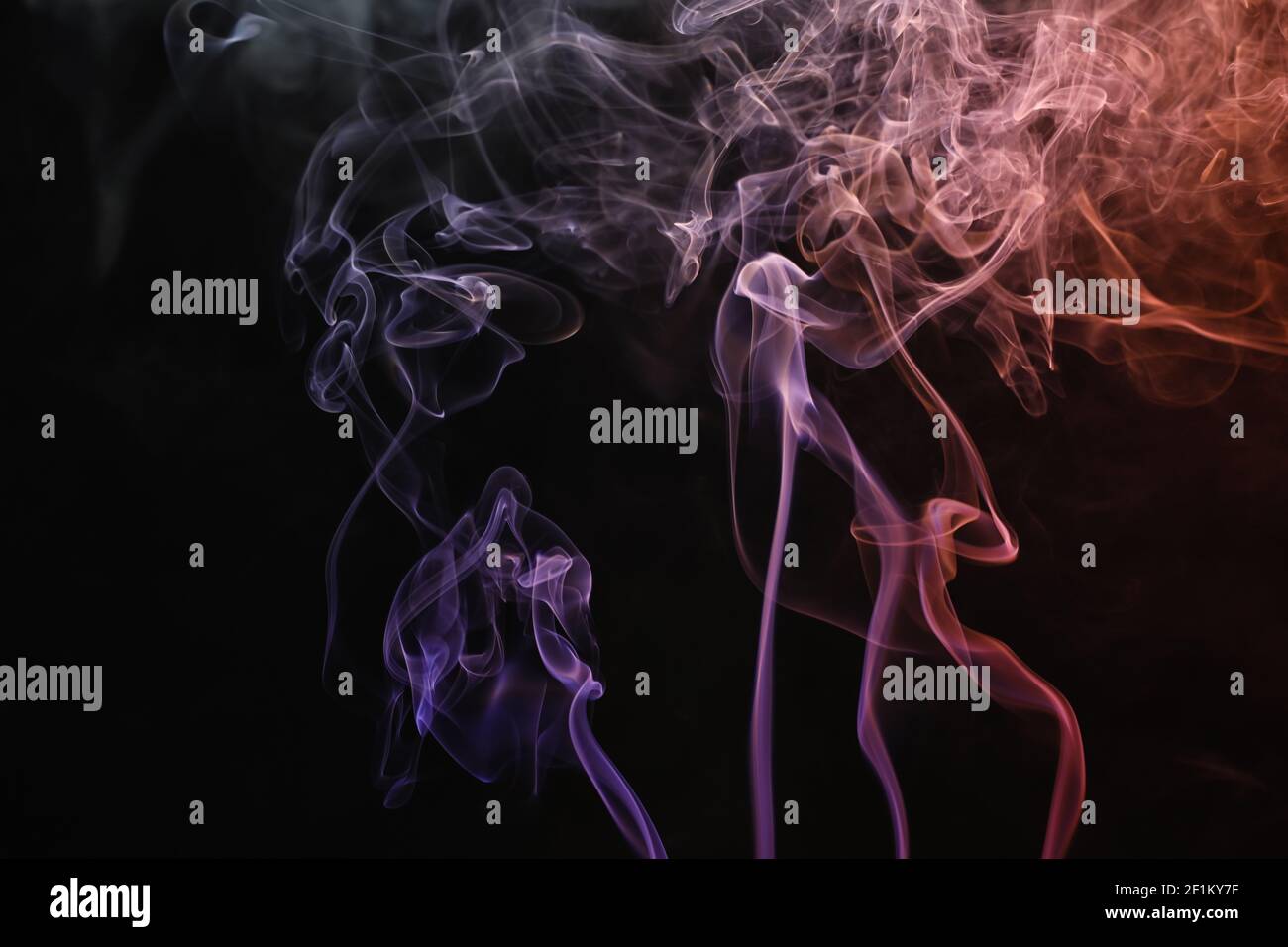 Color smoke on dark background Stock Photo - Alamy