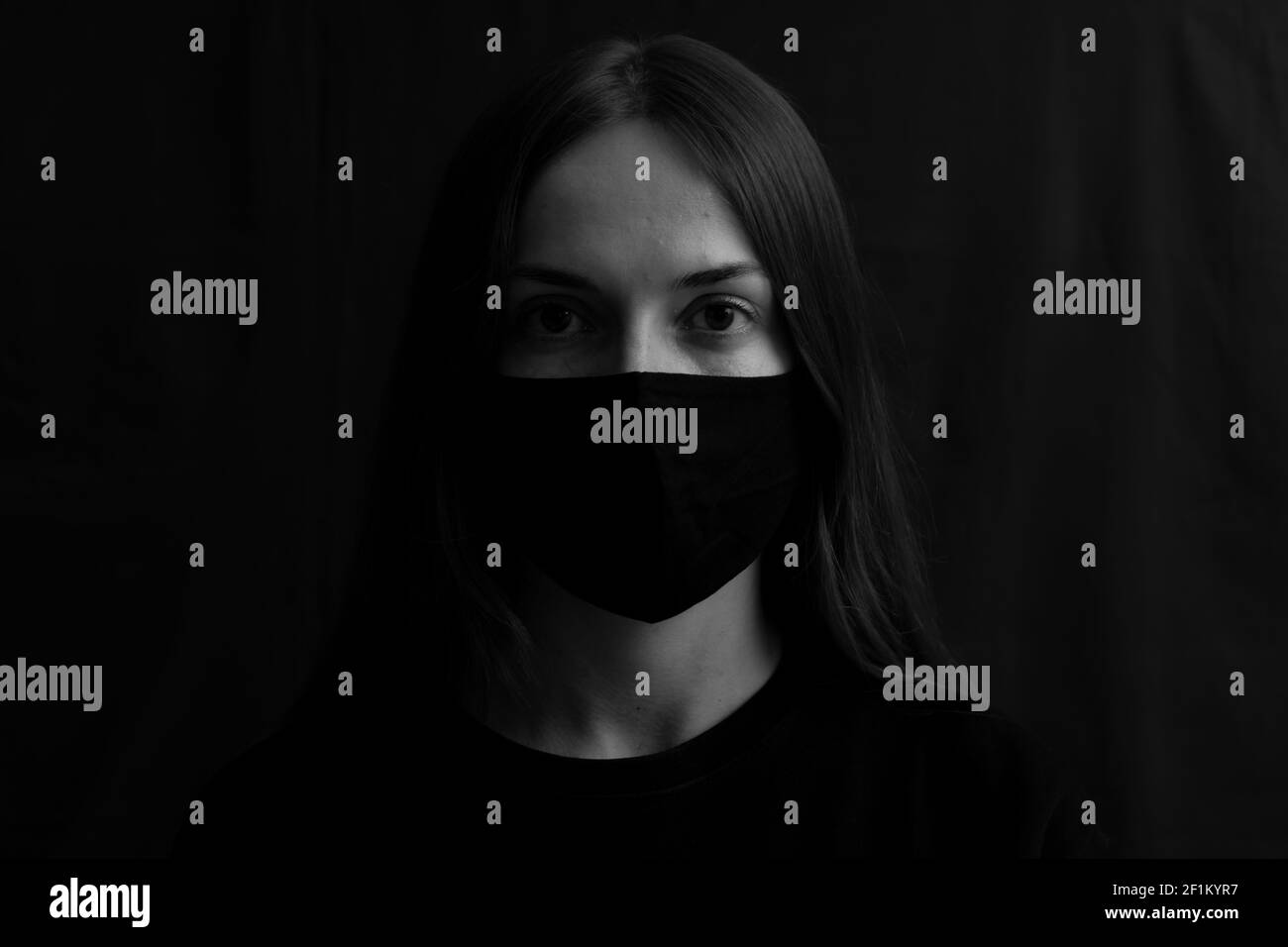 Woman wearing a black mask Stock Photo Alamy