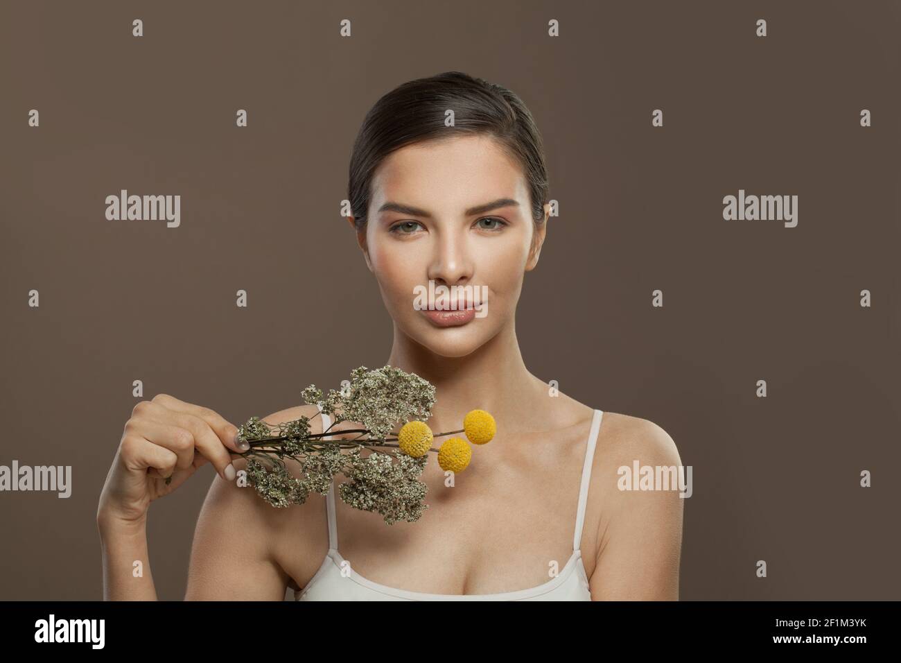 Beautiful female faces on brown background. Facial treatment, herbal