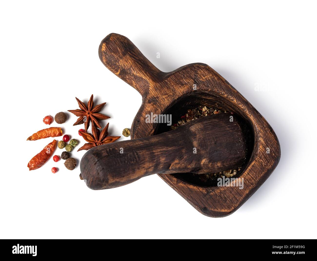 Mortar And Pestle With Pepper And Spices Stock Photo