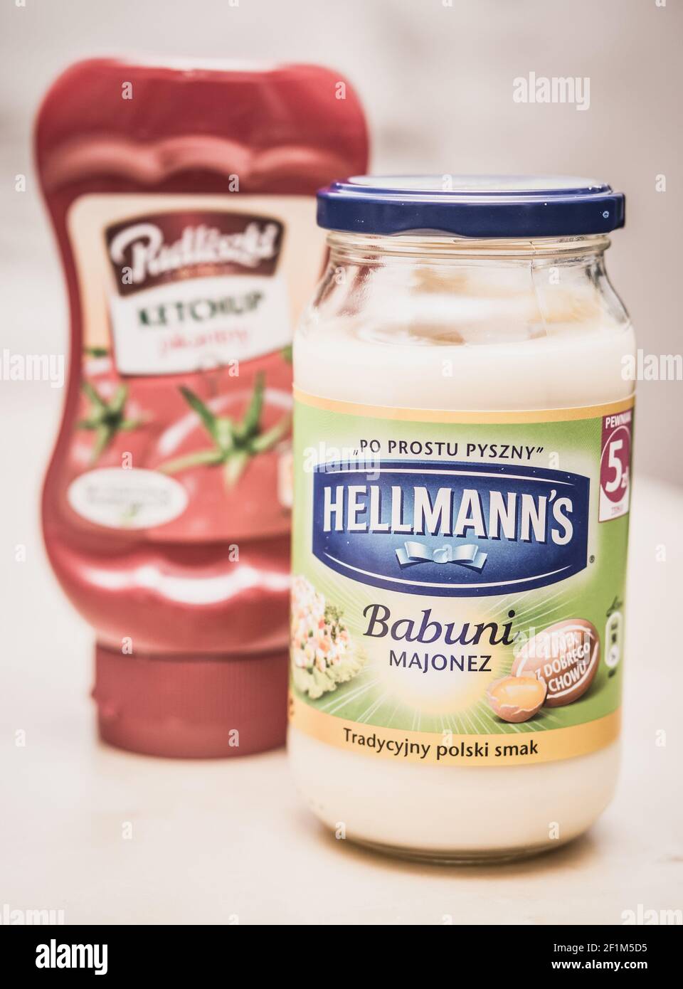 POZNAN, POLAND - Oct 09, 2016: Hellmann mayonnaise in a glass jar on table Stock Photo