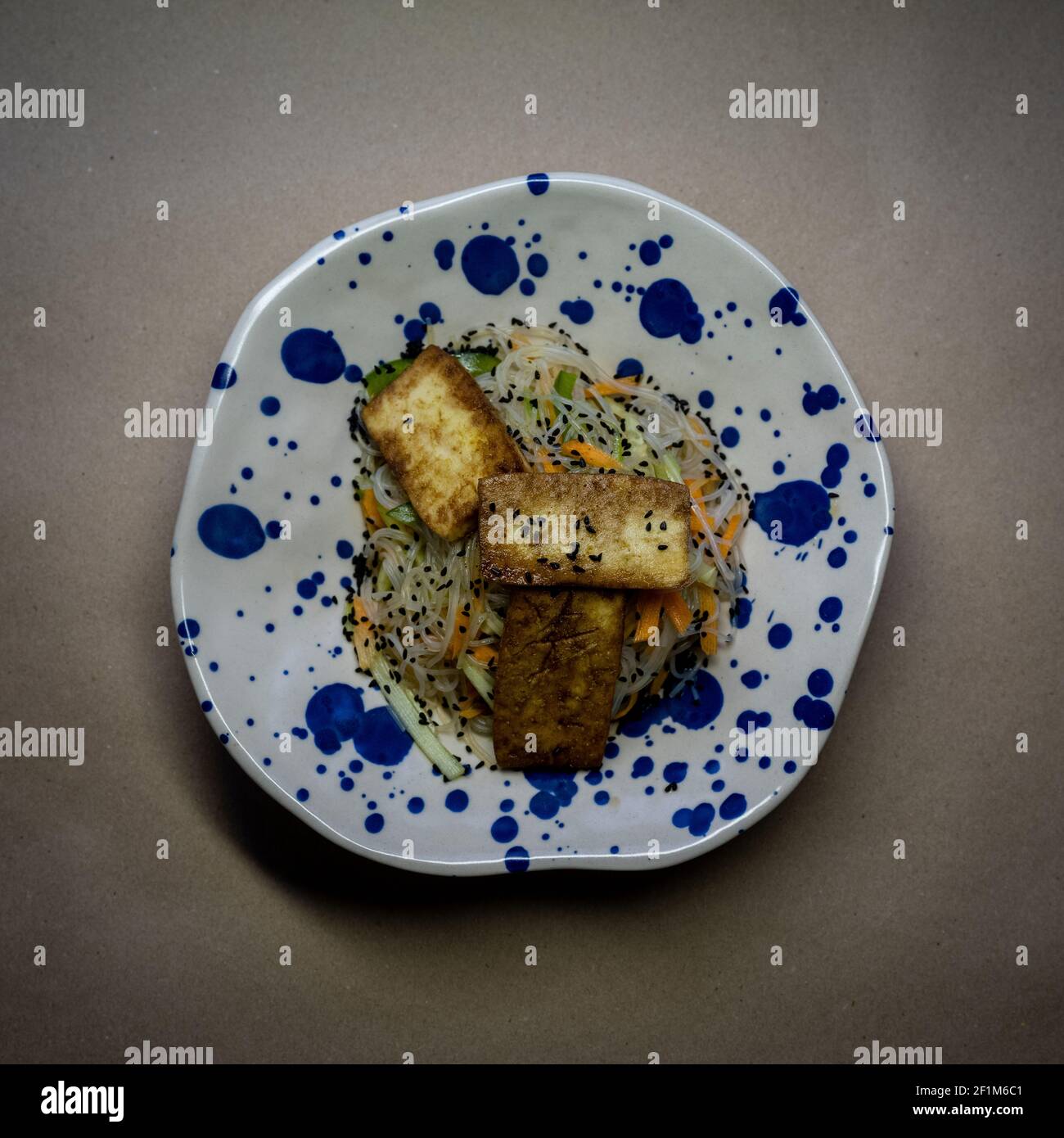 Fried tofu on rice noodles Stock Photo - Alamy