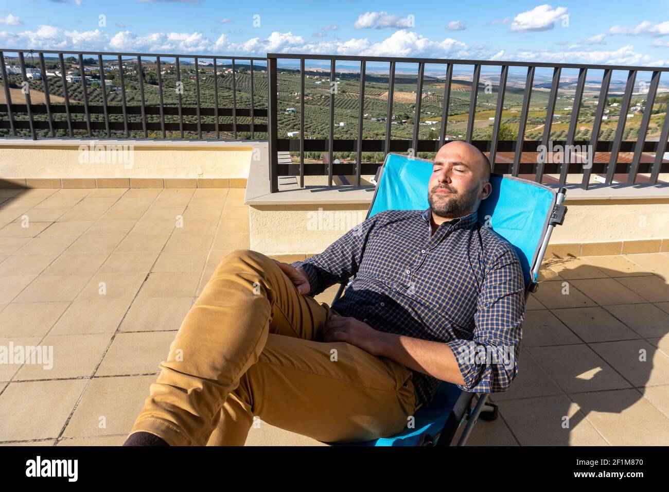Resting In Chair Stock photo of man resting and lying in a chair while enjoying sunny ...