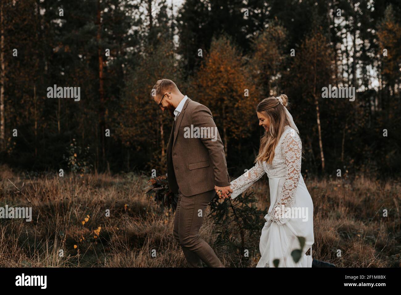 Bride and groom walking together Stock Photo