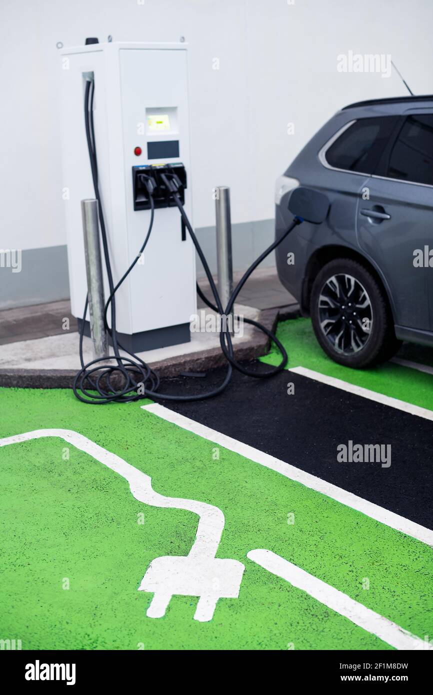 Parking spot with charging station sign Stock Photo Alamy