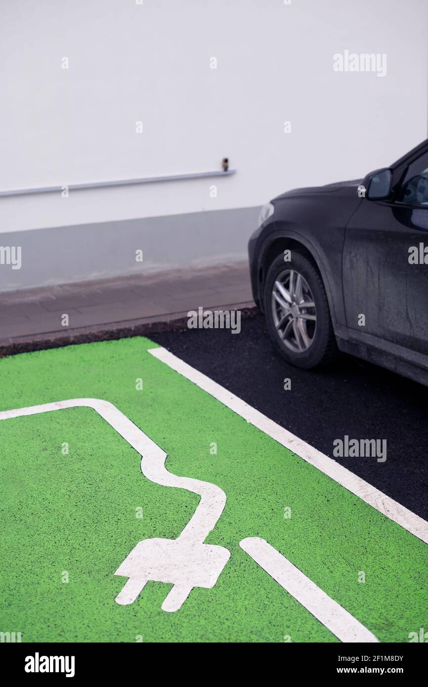 Parking spot with charging station sign Stock Photo Alamy