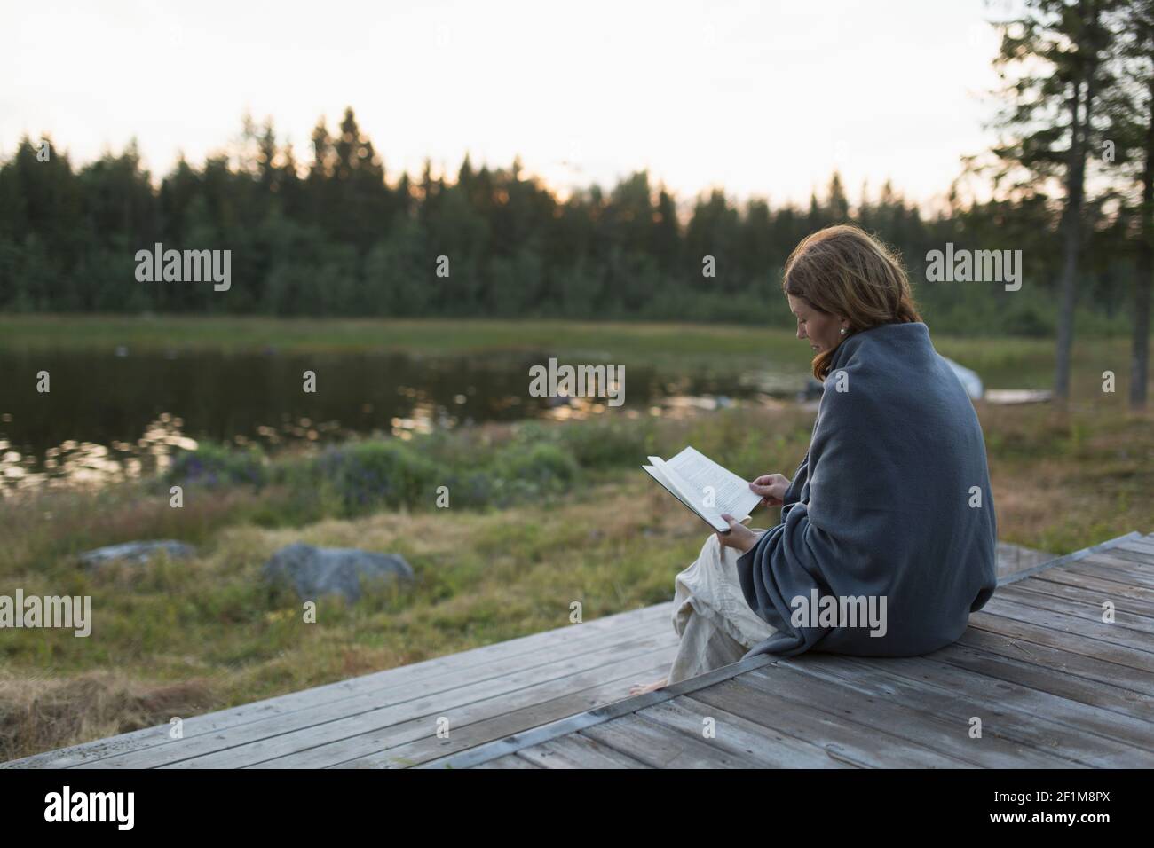 Woman reading book Stock Photo