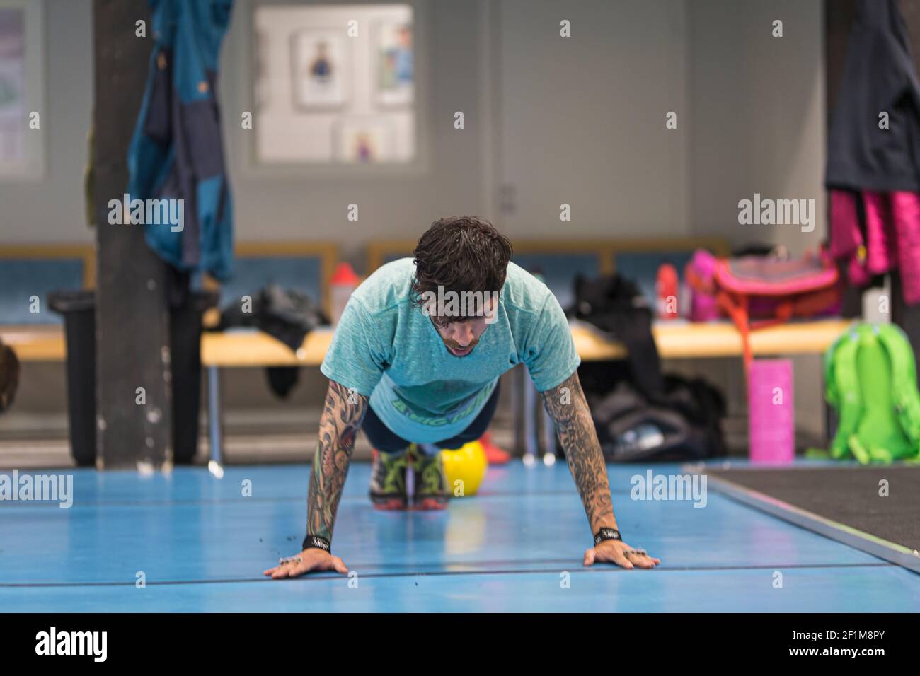 Man exercising in gym Stock Photo